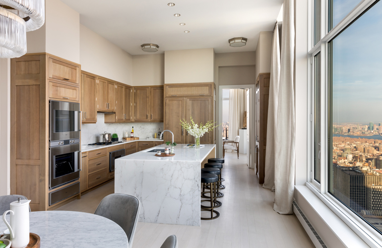 Premium kitchen with a marble island and a wide city view